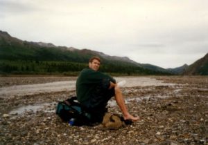 <b>Time To Ford .... Again! Slawdog Doesn't Look Happy</b><br> Slawdog changes into his Tevas once again for the double digit fords we made of the Toklat River on our last day on the trail. It took us eight hours to hike eight miles.