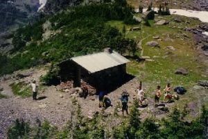 <b>Gunsight Pass</b><br> There's a small shelter at Gunsight Pass for emergency cover. In the photo, a group of backpackers and hikers take a break after the long climb to the ridge.