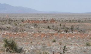 <b>Railroad station remains.</b><br> The railroad bed is in the foreground. This line ran from the silver mines at Mogollon to the main line at Socorro.