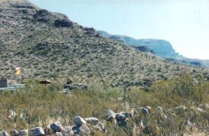 <b>Hnad laid rock fence</b><br> The line running up the hill face in the center of the photo is a hand laid rock wall to keep Frenshy's cows in. All were set in place by Frenchy, thousands of them, many over 100 lbs.