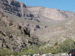 <b>Looking up the canyon</b><br> The boardwalk follows the path of the creek, which is indicated by the green trees in the creekbed.