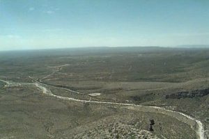 <b>Looking South</b><br> View from the top looking deep into Texas. White channel is a creekbed in which erosion has exposed the old reef from the time when this was the Permian Sea