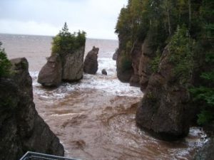 <b>Hopewell Rocks at almost high tide.</b><br> A short drive up the coast from Alma. At low tide you can walk around these rocks on dry ground.