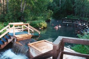 <b>Alpha Pool</b><br> Here is the upper Alpha Pool with the springs in the very back. There are wooden benches submerged under the water.