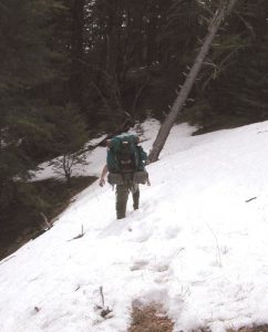 <b>Headign Out</b><br> In March, expect to find snow over 8,500 feet. Here Mike leads out through one of the covered trail sections. We found spots on the trail as deep as 3 feet.