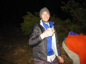 <b>Night Rider</b><br> Night Rider enjoys a doughboy at the campfire.