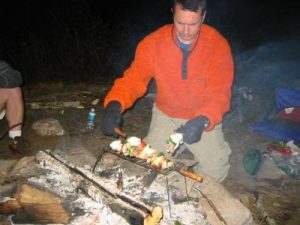 <b>Springer Diner</b><br> The Helmet cooks some kabobs over our campfire at the Springer Mountain campground.