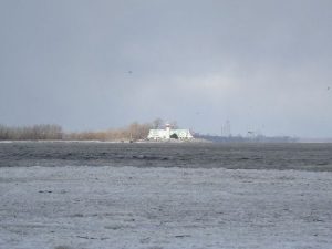 <b>Barrier Beach</b><br> Picture of lake taken from the barrier beach. A light house can be seen near the middle of the picture, and Cedar Point Amusement Park can be seen in the distance.