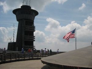 <b>Flag Flying At The Summit</b><br> You can't climb to the top of this tower, but there is a huge deck that offers views in every direction with mountains like the Smokies viewable in the remote distance.