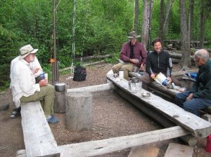 <b>Freeze-Dried Dinner Party</b><br> Backpackers enjoying the camaraderie of the trail at the Upper Kintla Lake campground food preparation area. 7/29/2010