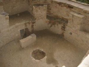 <b>Inside of a Kiva</b><br> That looks like a fireplace on the far wall, but it is an air ventilation shaft opening into the kiva and a deflector wall in front of it. The kiva was heated by a fire in the circular hole in the center of the floor. 10/22/10