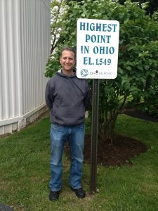 <b>Moondoggy</b><br> Moondoggy standing next to the sign that commemorates the highest point in Ohio atop Campbell Hill.